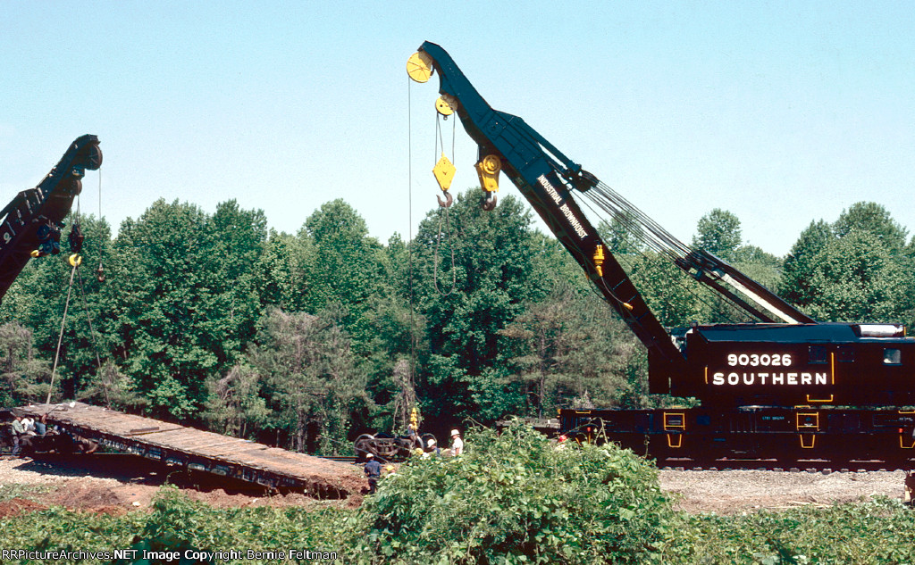 Southern Railway 250-ton Industrial Brownhoist derricks/wreckers #903016 and 903026 work to place Conrail flat car #716074 and its load back on the rails 